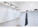Bright walk-in closet with built-in shelves and clothing rods, providing ample storage space at 19201 W Missouri Ave, Litchfield Park, AZ 85340