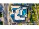Bird's eye view of a private backyard featuring a sparkling pool, spa, outdoor kitchen and manicured greenery, ideal for entertaining at 19912 E Natalie Way, Queen Creek, AZ 85142