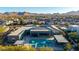 Expansive backyard boasting a modern pool, spa, outdoor kitchen, and meticulously maintained landscaping in a private retreat setting at 19912 E Natalie Way, Queen Creek, AZ 85142