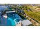 Aerial view of a backyard showcasing a refreshing pool, spa, outdoor kitchen, manicured landscaping and an expansive outdoor living space at 19912 E Natalie Way, Queen Creek, AZ 85142