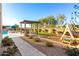 Backyard with pool, pergola and playground at 19912 E Natalie Way, Queen Creek, AZ 85142