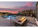 Luxury backyard featuring a built-in fire pit, and water fountains in the pool and spa at 19912 E Natalie Way, Queen Creek, AZ 85142