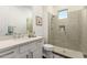 Bright bathroom with a white vanity, modern fixtures, and a glass-enclosed shower with tiled surround at 19912 E Natalie Way, Queen Creek, AZ 85142