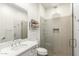 Modern bathroom with glass enclosed shower, quartz countertops, and sleek fixtures at 19912 E Natalie Way, Queen Creek, AZ 85142