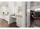 Bathroom features a double vanity, a makeup vanity, and a door leading to the closet at 19912 E Natalie Way, Queen Creek, AZ 85142