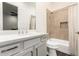 Bright bathroom featuring quartz countertop, ample cabinet space, and modern fixtures at 19912 E Natalie Way, Queen Creek, AZ 85142