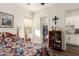 Bedroom with a cozy quilt bedspread, open closet, and convenient access to a modern kitchen area at 19912 E Natalie Way, Queen Creek, AZ 85142