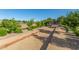 Enjoy the community bocce ball court surrounded by trees and landscaping at 19912 E Natalie Way, Queen Creek, AZ 85142
