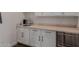 A sleek countertop is fitted with an undermount sink, modern faucet, and stainless steel dishwasher at 19912 E Natalie Way, Queen Creek, AZ 85142