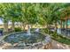 Relax by the community water feature with its tranquil fountain and meticulous, mature landscaping at 19912 E Natalie Way, Queen Creek, AZ 85142