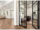 Inviting foyer leads into a bright living space with elegant glass doors and stylish decor at 19912 E Natalie Way, Queen Creek, AZ 85142
