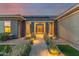 Inviting walkway to the front door featuring manicured landscaping and ambient lighting at 19912 E Natalie Way, Queen Creek, AZ 85142