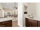Open-concept interior showcasing a wet bar with stylish finishes and an expansive living space at 19912 E Natalie Way, Queen Creek, AZ 85142
