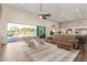 Open-concept living area featuring a seamless indoor-outdoor flow and views of the refreshing pool at 19912 E Natalie Way, Queen Creek, AZ 85142