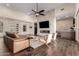 Bright living room with a modern fireplace, high ceilings, and stylish furnishings, perfect for entertaining at 19912 E Natalie Way, Queen Creek, AZ 85142