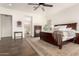 Spacious main bedroom features a luxurious bed, decorative furnishings, and a calming ambiance at 19912 E Natalie Way, Queen Creek, AZ 85142