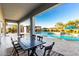 Outdoor dining area overlooking the pool and spa, perfect for entertaining guests at 19912 E Natalie Way, Queen Creek, AZ 85142