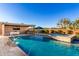Beautiful backyard oasis with pool, fountains and a covered outdoor kitchen and lounge at 19912 E Natalie Way, Queen Creek, AZ 85142