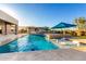 Beautiful backyard with pool, fountains, in-pool loungers and outdoor kitchen at 19912 E Natalie Way, Queen Creek, AZ 85142