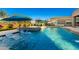 Resort style pool with in-pool loungers, hot tub, and a lush backyard at 19912 E Natalie Way, Queen Creek, AZ 85142