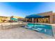 Beautiful backyard pool with spa, outdoor seating and mature landscaping at 19912 E Natalie Way, Queen Creek, AZ 85142