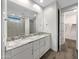 Modern bathroom featuring double sinks, granite countertops, and walk-in shower at 2061 W Burnside Trl, Phoenix, AZ 85085