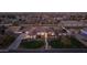 A beautiful single-story house with desert landscaping and a white fence on a spacious lot at dusk at 21442 E Excelsior Ave, Queen Creek, AZ 85142