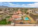 Aerial view of the property showcasing the swimming pool, expansive backyard, and surrounding neighborhood at 21442 E Excelsior Ave, Queen Creek, AZ 85142