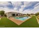 Relaxing backyard pool and patio area, perfect for entertaining and enjoying outdoor living in style at 21442 E Excelsior Ave, Queen Creek, AZ 85142