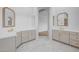 Bright bathroom featuring dual vanities with marble flooring at 21442 E Excelsior Ave, Queen Creek, AZ 85142