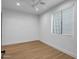 Bedroom with a ceiling fan and large window with blinds at 21442 E Excelsior Ave, Queen Creek, AZ 85142