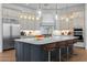 A gourmet kitchen boasts a large island, stainless steel appliances, and custom cabinetry at 21442 E Excelsior Ave, Queen Creek, AZ 85142
