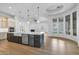 Spacious open floor plan features an expansive kitchen island with seating and stainless steel appliances at 21442 E Excelsior Ave, Queen Creek, AZ 85142