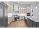 Bright kitchen showcases stainless steel appliances, quartz countertops, and custom cabinets at 21442 E Excelsior Ave, Queen Creek, AZ 85142