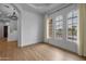 Bright living room featuring three arched windows offering great views at 21442 E Excelsior Ave, Queen Creek, AZ 85142