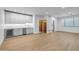Spacious living room with white kitchen cabinets, a wine fridge, and modern appliances at 21442 E Excelsior Ave, Queen Creek, AZ 85142
