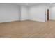 Large living room with light wood floors throughout at 21442 E Excelsior Ave, Queen Creek, AZ 85142