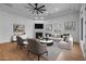 The open-concept living room offers a fireplace, tray ceilings, and recessed lighting at 21442 E Excelsior Ave, Queen Creek, AZ 85142