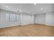 Bright living room with a large window and hardwood floors at 21442 E Excelsior Ave, Queen Creek, AZ 85142