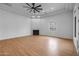 Large living room with vinyl floor, large ceiling fan, and ample natural light at 21442 E Excelsior Ave, Queen Creek, AZ 85142