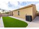 A well maintained backyard with artificial grass for easy upkeep at 227 E Carob Dr, Chandler, AZ 85286