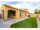 Backyard patio with covered area and artificial grass for low maintenance at 227 E Carob Dr, Chandler, AZ 85286