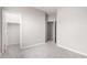 Neutral bedroom featuring two open doorways and carpeted floors at 227 E Carob Dr, Chandler, AZ 85286