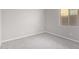 Neutral bedroom with a window and carpeted floors at 227 E Carob Dr, Chandler, AZ 85286