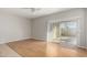 Spacious living room with wood floors and sliding glass doors leading to the patio at 227 E Carob Dr, Chandler, AZ 85286