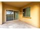 Covered patio with sliding glass doors and a window looking out to backyard at 227 E Carob Dr, Chandler, AZ 85286