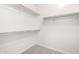 Walk-in closet features built-in shelving and carpeted flooring at 227 E Carob Dr, Chandler, AZ 85286