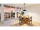 Bright dining area with a round glass table, seating for four, and balcony access with city views at 2323 N Central Ave # 1902, Phoenix, AZ 85004