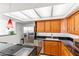 Kitchen with stainless steel appliances, granite countertops, and oak cabinetry at 2323 N Central Ave # 1902, Phoenix, AZ 85004