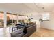 Open living space featuring tiled floors, a black leather sofa, and city views from the balcony at 2323 N Central Ave # 1902, Phoenix, AZ 85004